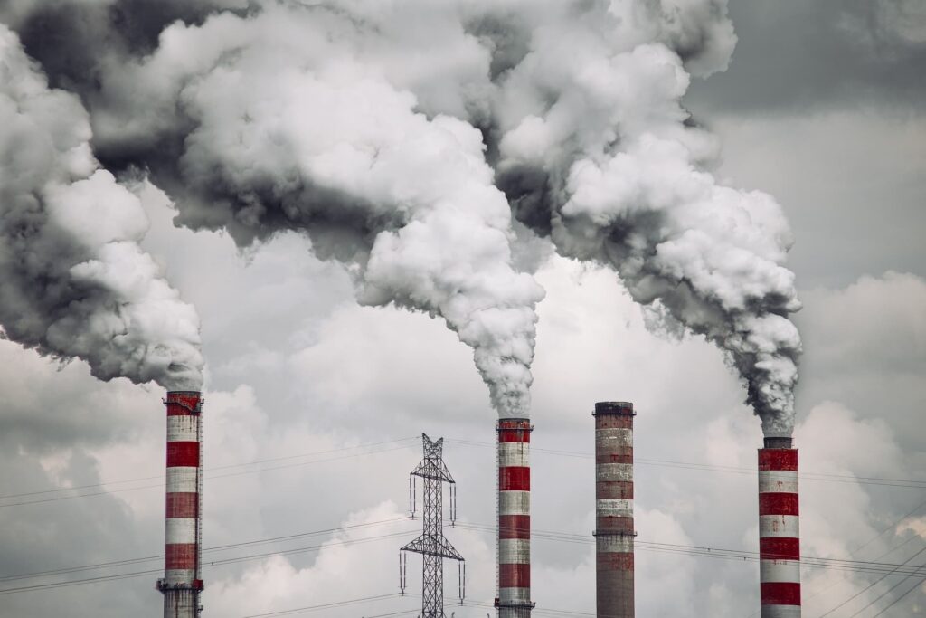 Power station with smoke coming from chimneys